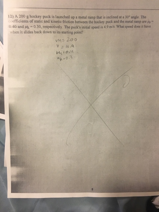 Solved 12) A 200 g hockey puck is launched up a metal ramp