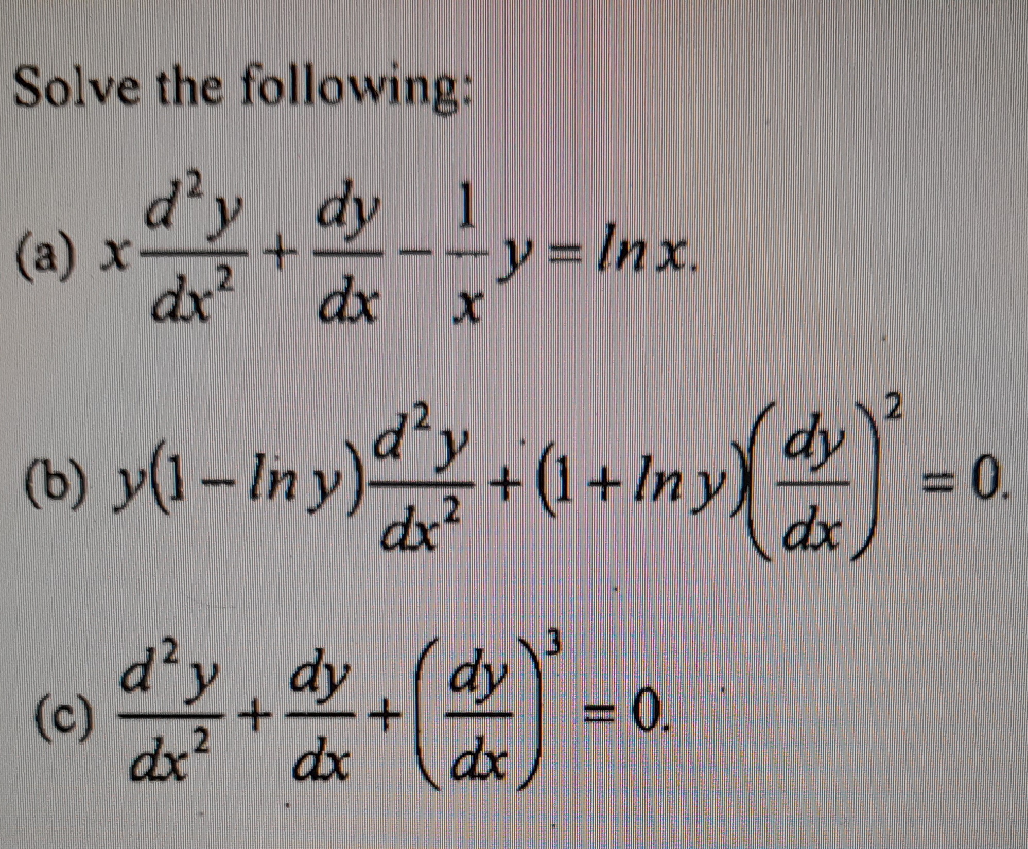 Solve the following: (a) \( x \frac{d^{2} y}{d x^{2}}+\frac{d y}{d x}-\frac{1}{x} y=\ln x \) (b) \( y(1-\ln y) \frac{d^{2} y}