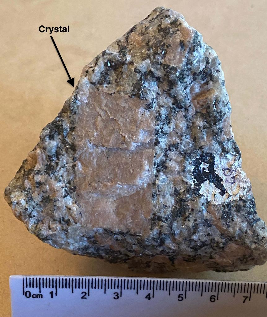 Solved Identify the large, opaque pink crystal in this | Chegg.com
