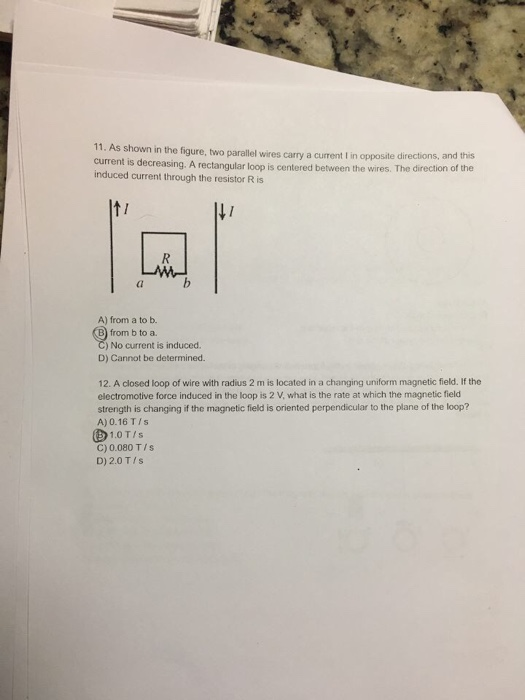 Solved 11. As shown in the figure, two parallel wires carry | Chegg.com