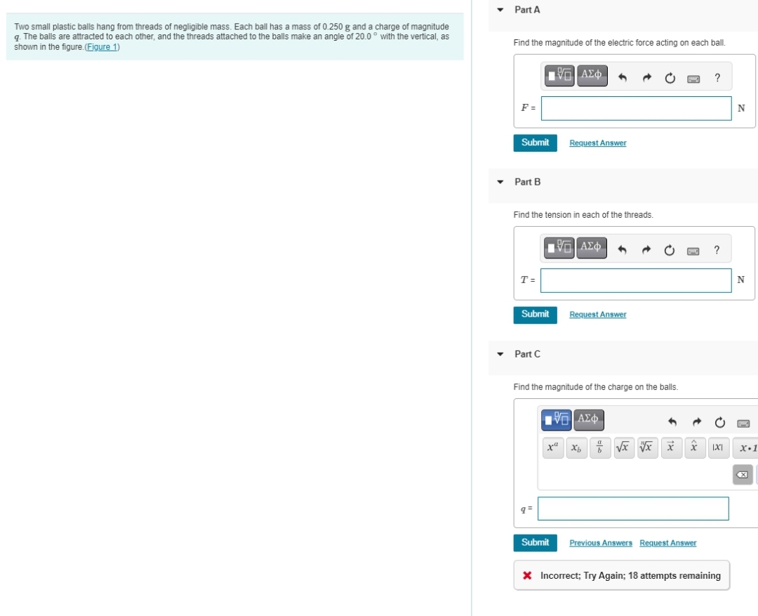 Two small plastic balls hang from threads of