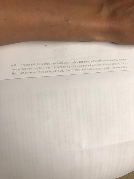 Solved 9.12 The left end of a spring is attached to a wall