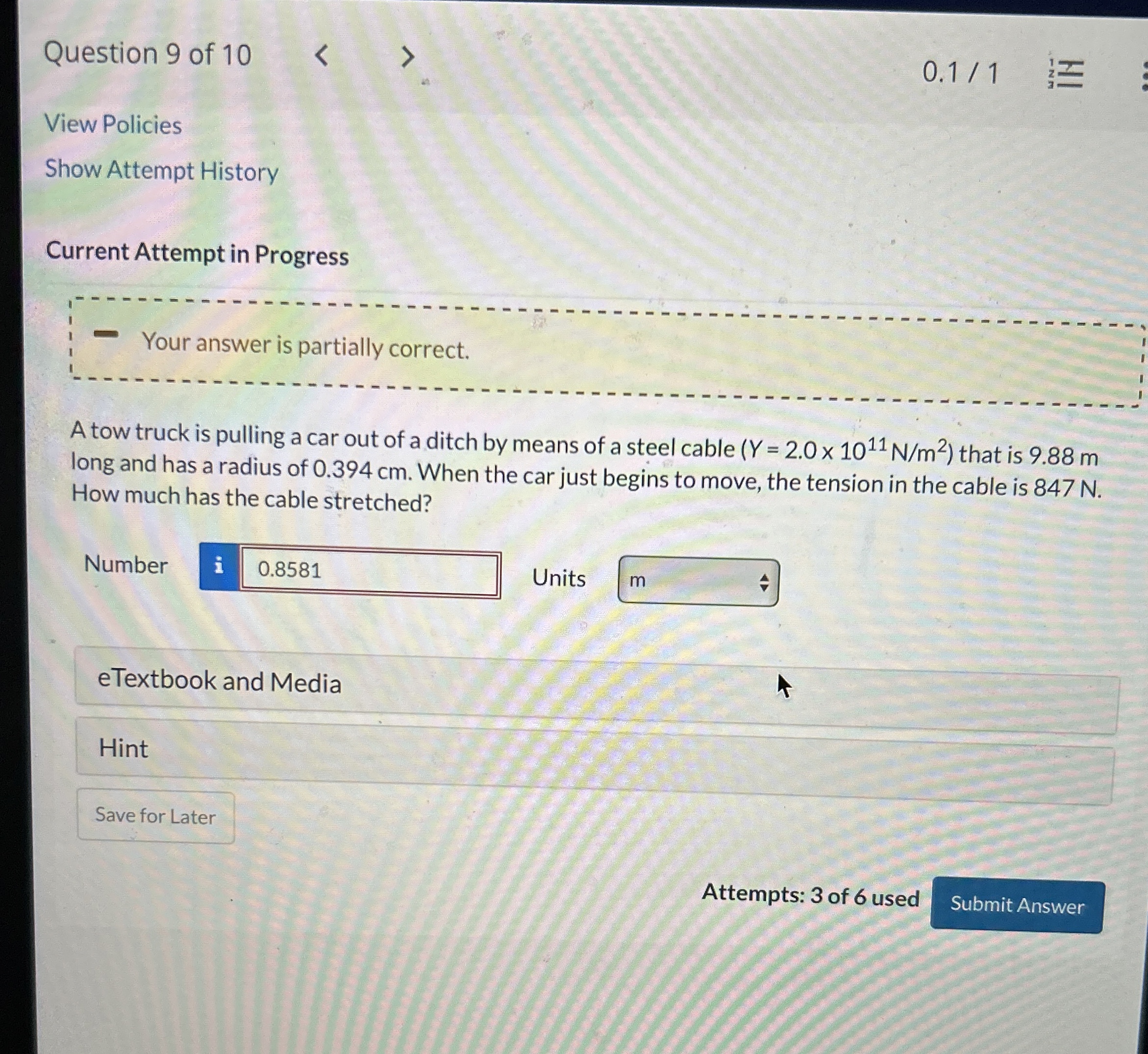 A tow truck is pulling a car out of a ditch by means