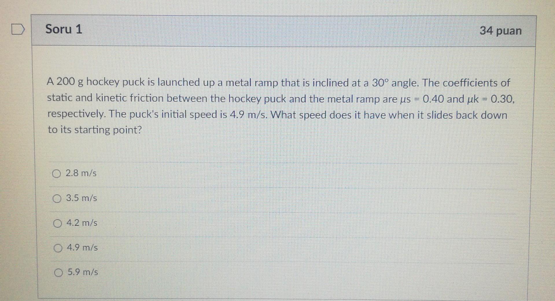 Solved A 200 g hockey puck is launched up a metal ramp that