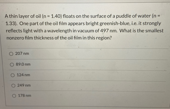 Solved A thin layer of oil (n = 1.40) floats on the surface | Chegg.com