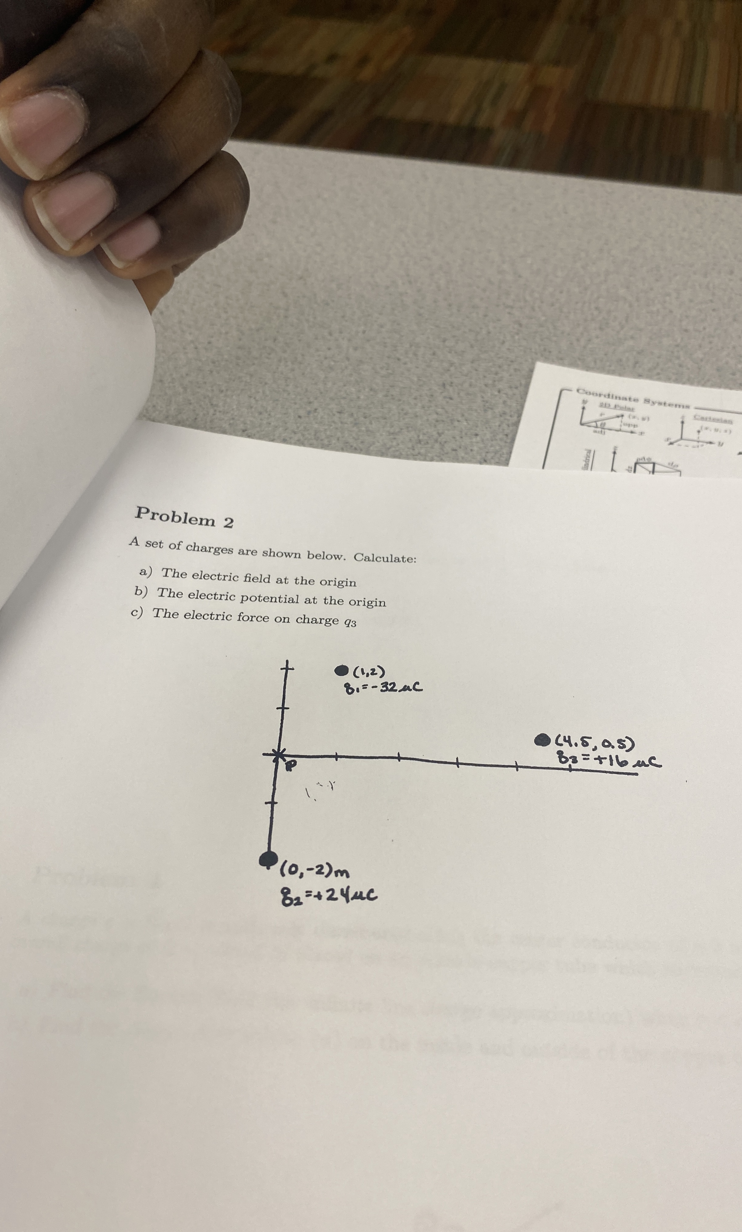 Problem 2A set of charges are shown below. | Chegg.com