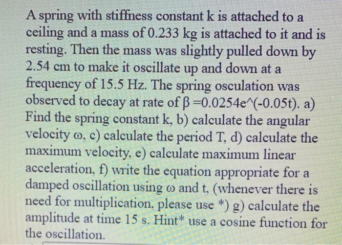 Solved A spring with stiffness constant k is attached to a | Chegg.com