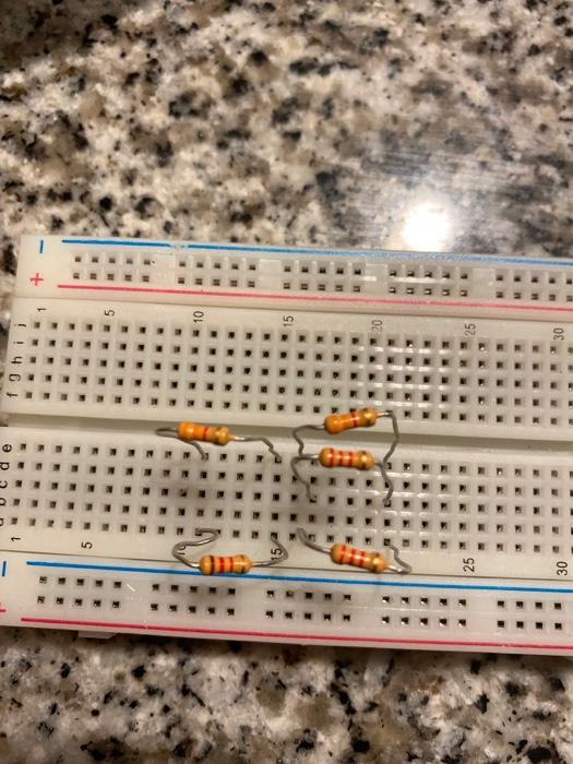 Solved Build the circuit below using a breadboard and | Chegg.com