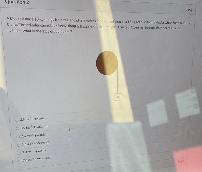 Solved Question 2 5 pts A block of mass 10 kg hangs from the | Chegg.com
