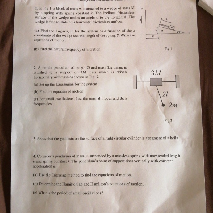 Solved z 1. In Fig. 1, a block of mass m is attached to a | Chegg.com