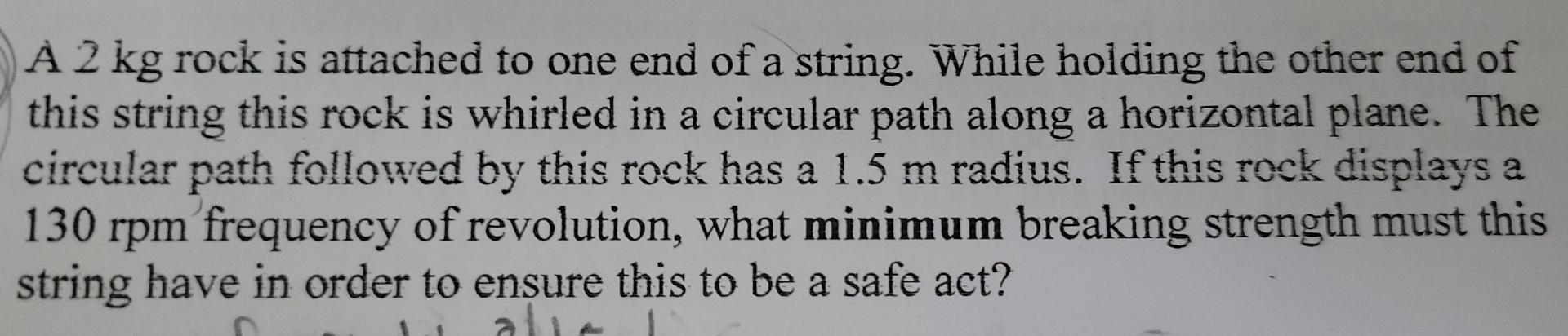 Solved À 2 kg rock is attached to one end of a string. While | Chegg.com