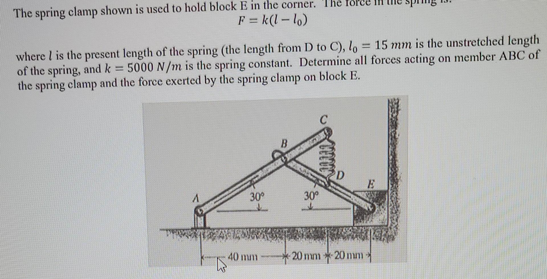 Solved The spring clamp shown is used to hold block E in the | Chegg.com