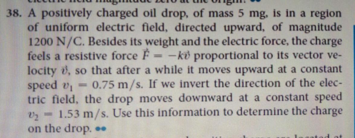 Solved 38. A positively charged oil drop, of mass 5 mg, is | Chegg.com