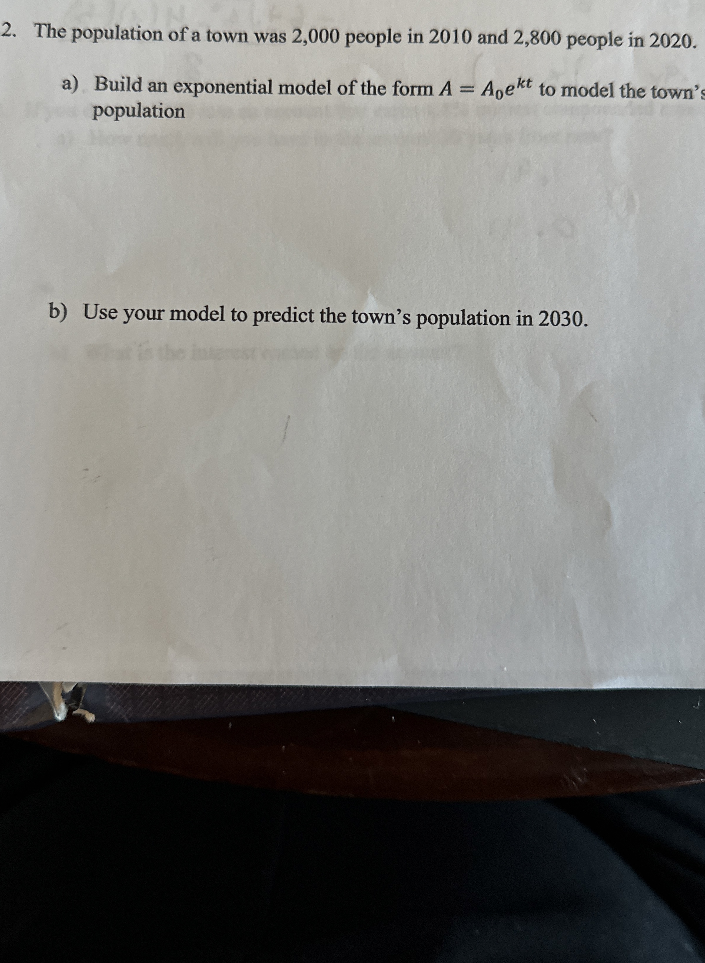 Solved The population of a town was 2,000 ﻿people in 2010 | Chegg.com