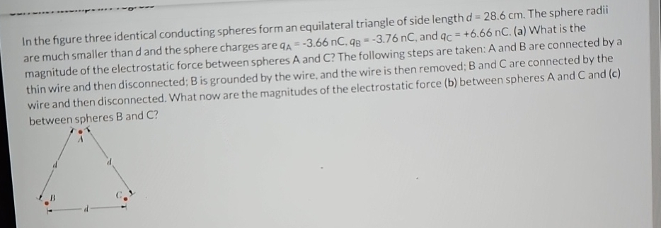 Solved In the figure three identical conducting spheres form | Chegg.com