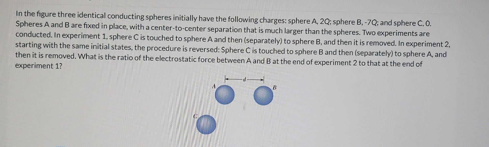 Solved In The Figure Three Identical Conducting Spheres | Chegg.com