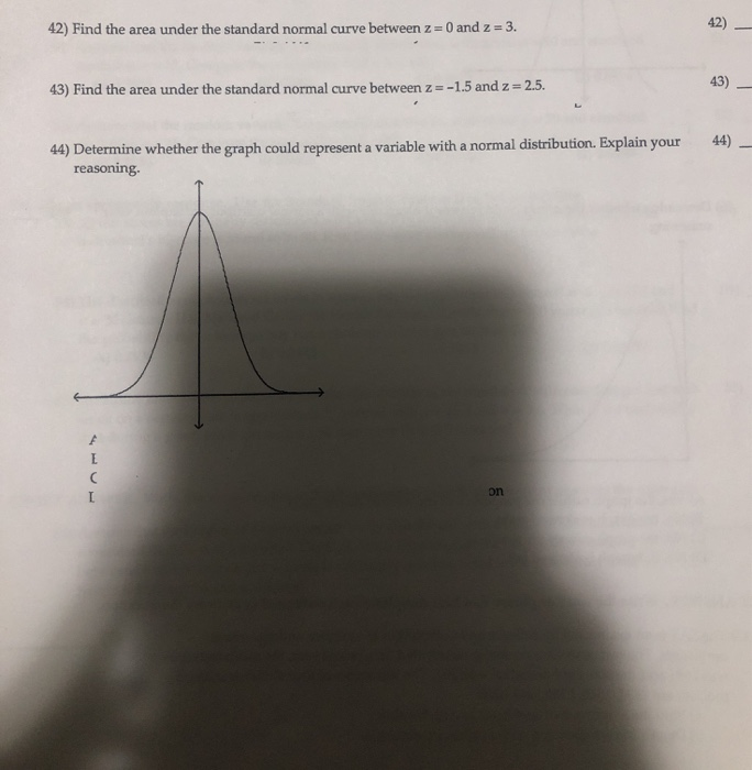 Solved 42) Find the area under the standard normal curve | Chegg.com