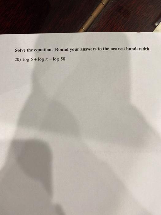 Solved Solve the equation. Round your answers to the nearest | Chegg.com