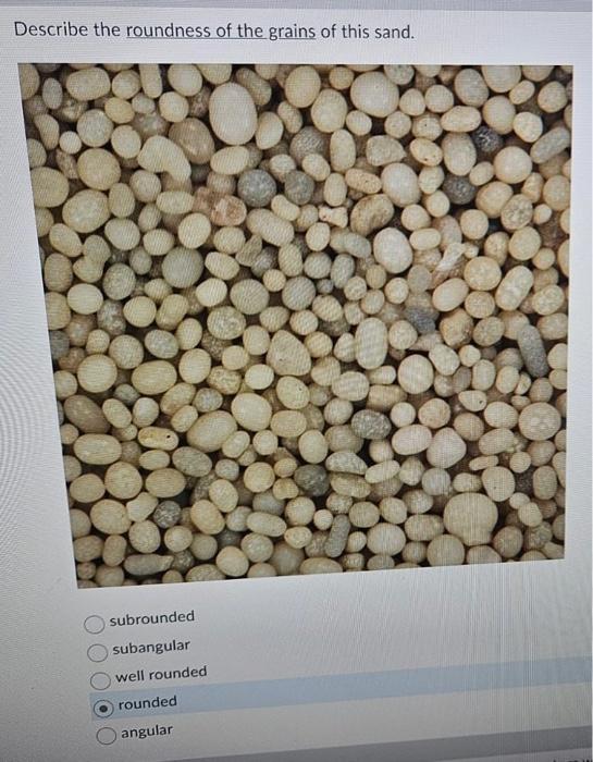 Solved Examine the sand in the photo below. The rounded | Chegg.com