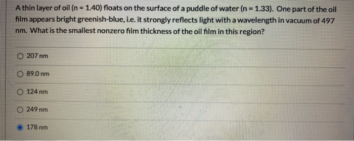 Solved A thin layer of oil (n = 1.40) floats on the surface | Chegg.com