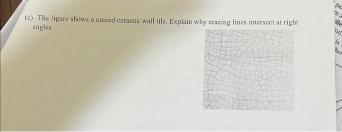 (c) The figure shows a crazed ceramic wall tile. Explain why crazing lines intersect at right angles.