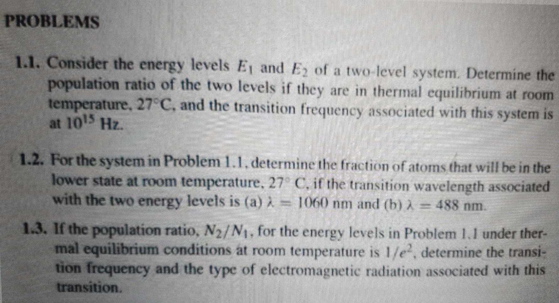 Solved PROBLEMS 1.1. Consider the energy levels E, and E2 of | Chegg.com