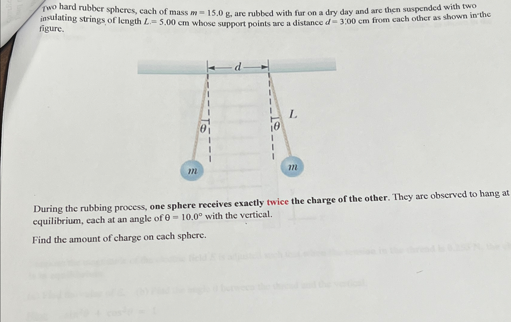 Two hard rubber spheres, each of mass m=15.0g, ﻿are