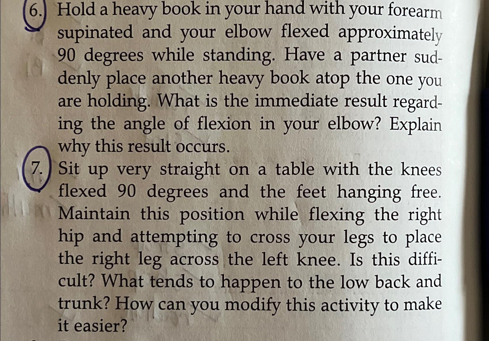 Solved (6.) ﻿Hold a heavy book in your hand with your | Chegg.com
