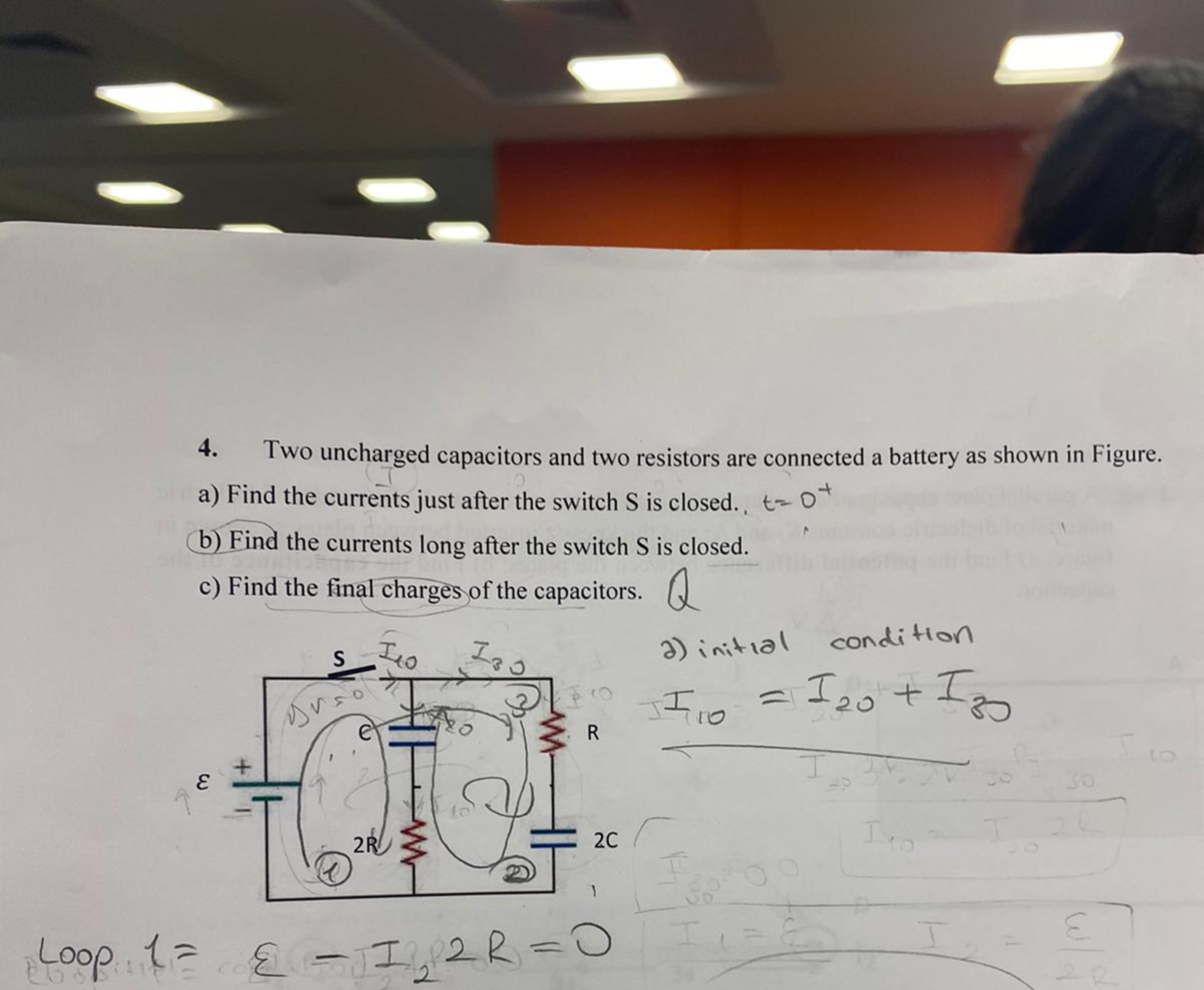 Two uncharged capacitors and two resistors are