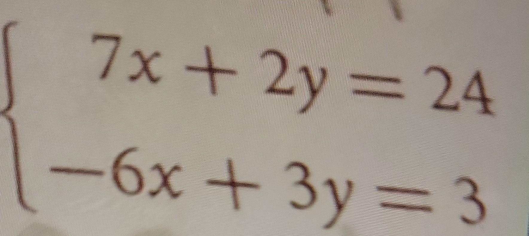 Solved {7x+2y=24−6x+3y=3 | Chegg.com