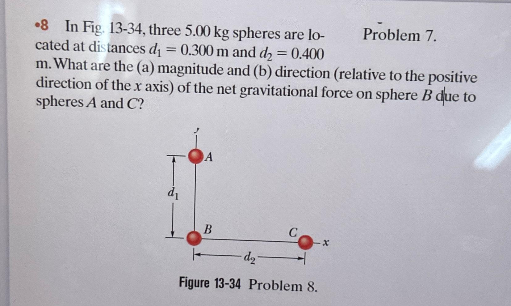 Solved -8 ﻿In Fig. 13-34, ﻿three 5.00kg ﻿spheres are | Chegg.com