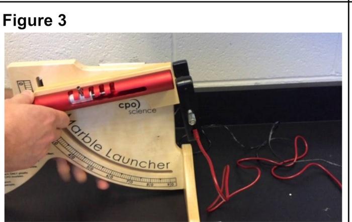 Solved 6. See Figure 3. A spring loaded marble launcher, | Chegg.com