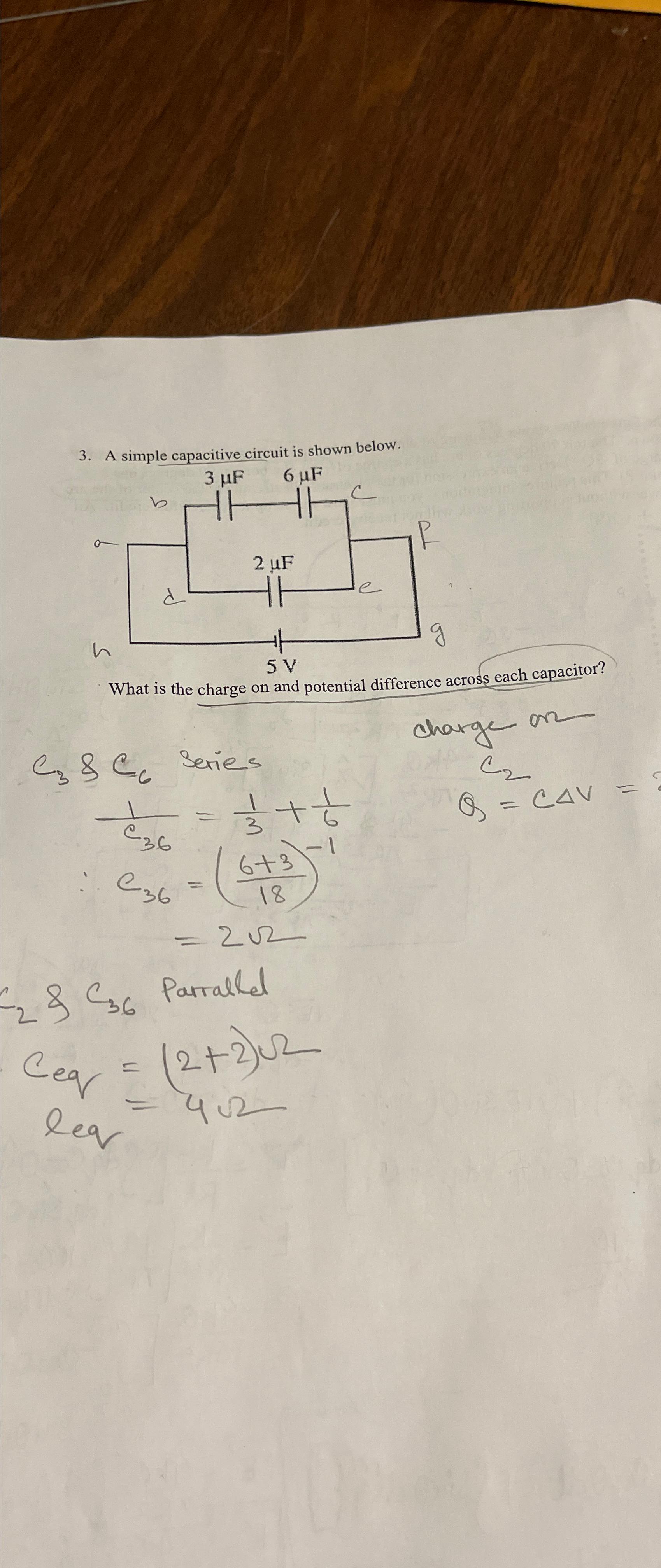 Solved A simple capacitive circuit is shown below.What is | Chegg.com