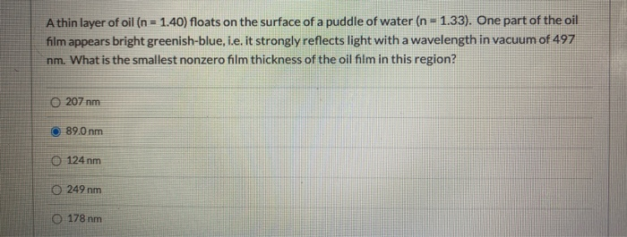 Solved A thin layer of oil (n = 1.40) floats on the surface | Chegg.com